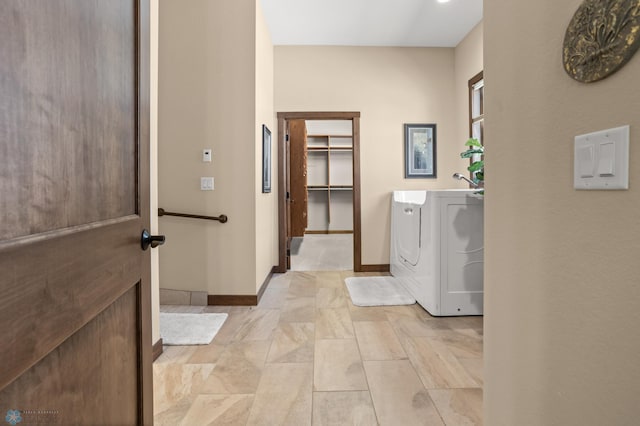 106 Beaton Dr, West Fargo, ND 58078 - laundry area featuring washer / clothes dryer and baseboards