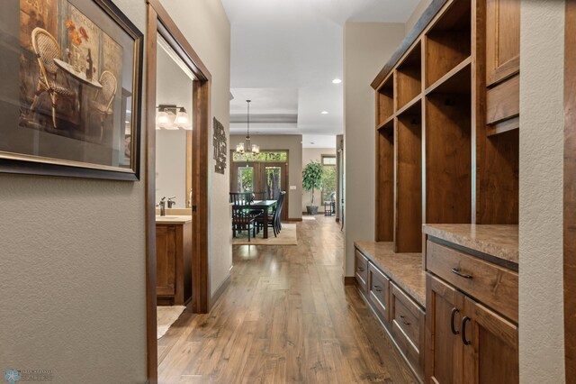 106 Beaton Dr, West Fargo, ND 58078 - mudroom with dark wood-style floors, a chandelier, recessed lighting, a textured wall, and baseboards