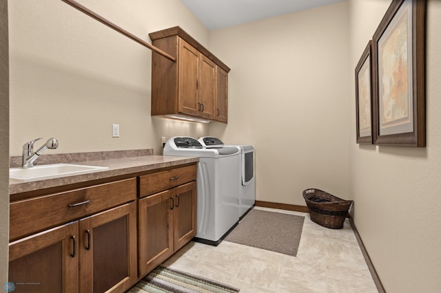 106 Beaton Dr, West Fargo, ND 58078 - laundry room featuring cabinet space, washer and dryer, and baseboards