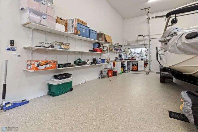 106 Beaton Dr, West Fargo, ND 58078 - garage featuring a workshop area