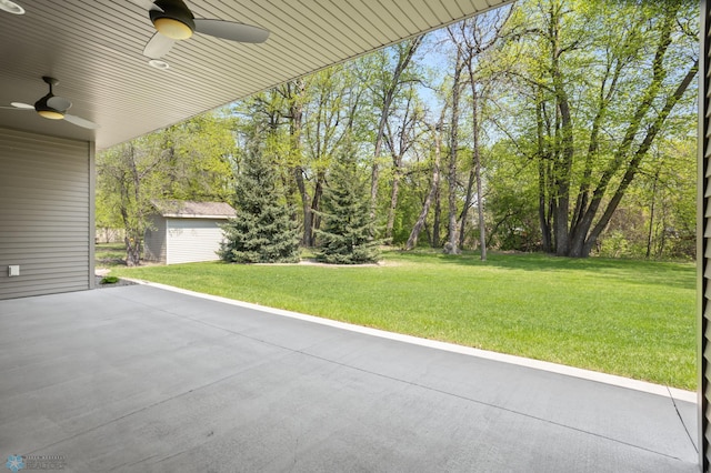 106 Beaton Dr, West Fargo, ND 58078 - view of patio / terrace featuring ceiling fan and an outbuilding