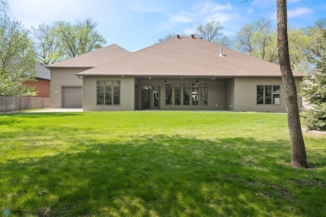 106 Beaton Dr, West Fargo, ND 58078 - rear view of house featuring ceiling fan, a garage, and a shingled roof