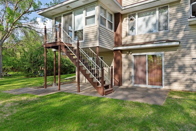 16 Crestview Bay, Faribault, MN 55021 - rear view of property with a patio area, a lawn, and stairs