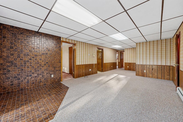 16 Crestview Bay, Faribault, MN 55021 - empty room featuring a paneled ceiling, a wainscoted wall, wallpapered walls, and carpet floors