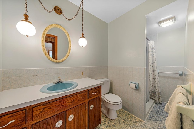 16 Crestview Bay, Faribault, MN 55021 - bathroom with tile walls, tile patterned flooring, wainscoting, a shower stall, and vanity