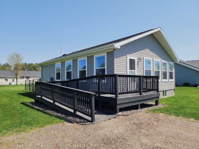 305 4th Ave SW, Milltown, WI 54858 - rear view of house with a deck and a yard