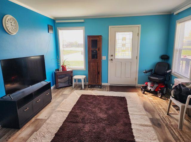305 4th Ave SW, Milltown, WI 54858 - foyer with crown molding, light wood-style floors, and baseboards