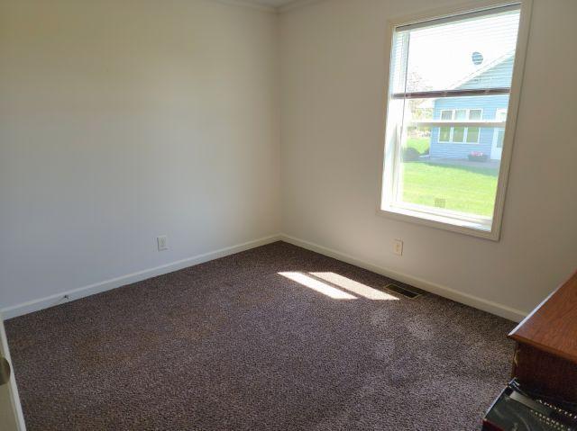 305 4th Ave SW, Milltown, WI 54858 - carpeted empty room featuring baseboards