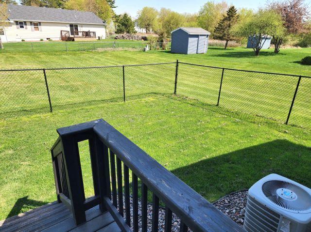 305 4th Ave SW, Milltown, WI 54858 - view of yard featuring central AC, a shed, and an outbuilding
