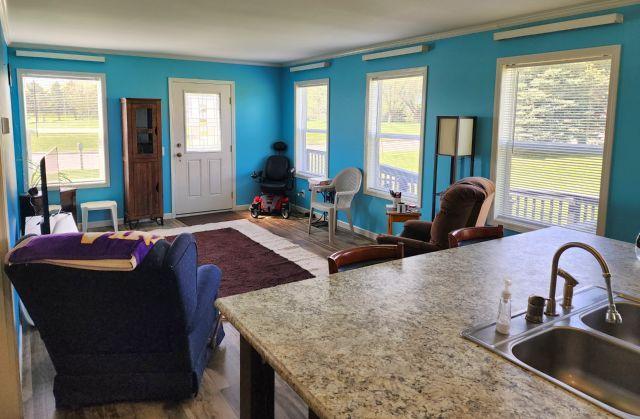 305 4th Ave SW, Milltown, WI 54858 - living room with wood finished floors and ornamental molding