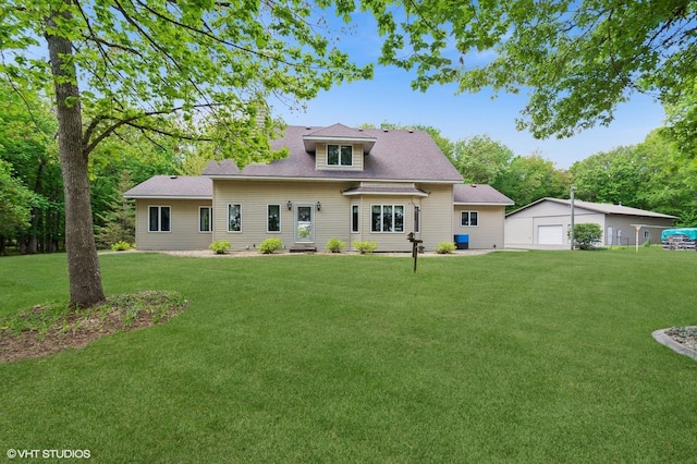 28075 Zuni St NW, Isanti, MN 55040 - view of front of property with a front lawn, an outdoor structure, and a detached garage