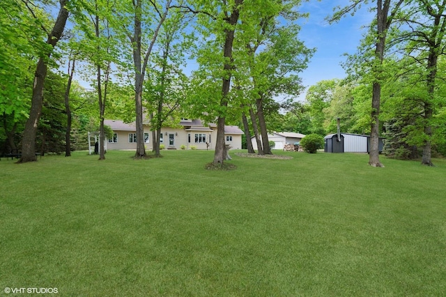 28075 Zuni St NW, Isanti, MN 55040 - view of green lawn featuring an outbuilding and a storage unit