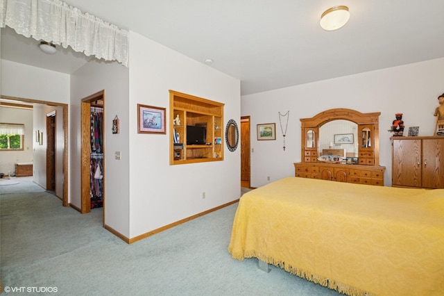28075 Zuni St NW, Isanti, MN 55040 - bedroom with carpet floors, a walk in closet, baseboards, and a closet