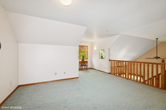 28075 Zuni St NW, Isanti, MN 55040 - additional living space with carpet floors, lofted ceiling, baseboards, and a ceiling fan