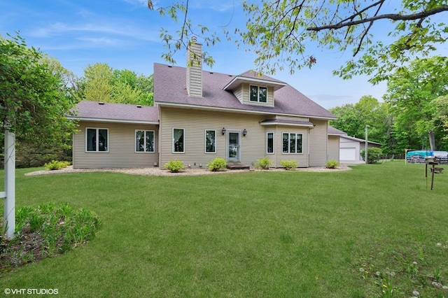28075 Zuni St NW, Isanti, MN 55040 - back of property featuring a yard, a chimney, and a garage