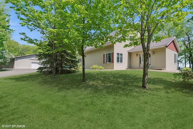 28075 Zuni St NW, Isanti, MN 55040 - view of property hidden behind natural elements featuring a front yard and an outbuilding