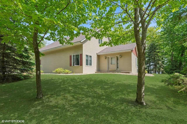 28075 Zuni St NW, Isanti, MN 55040 - view of front facade with a front lawn and a shingled roof