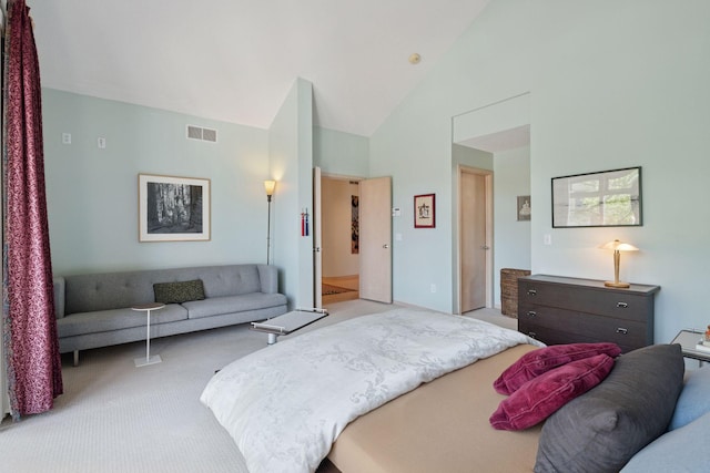 carpeted bedroom with vaulted ceiling