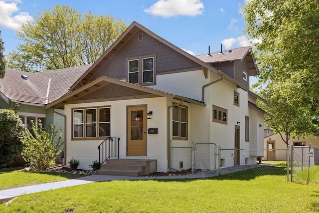 view of front of home featuring a gate and stucco siding