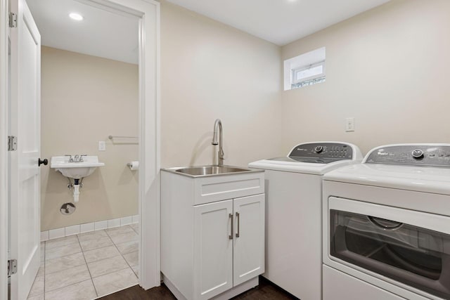 clothes washing area featuring washer and dryer, recessed lighting, cabinet space, and baseboards