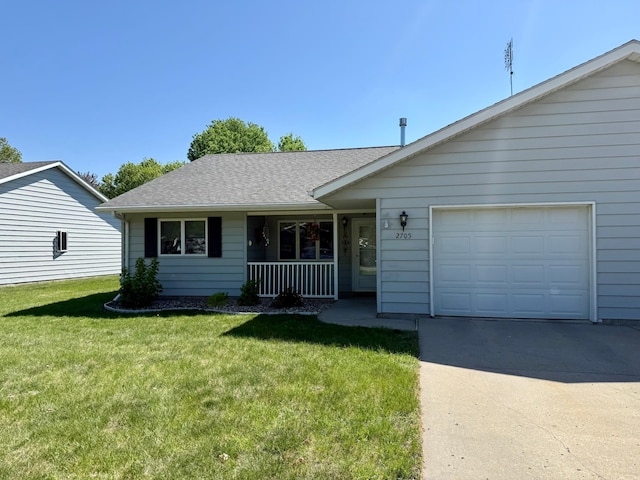 view of front facade with concrete driveway, covered porch, a garage, a front lawn, and roof with shingles