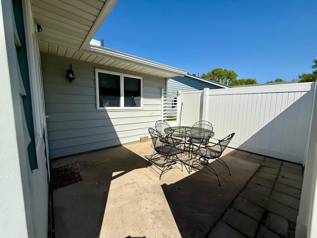 view of patio / terrace featuring outdoor dining space and fence