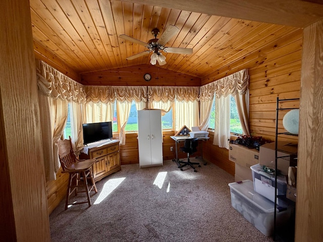 office featuring vaulted ceiling, ceiling fan, carpet floors, wooden ceiling, and wooden walls