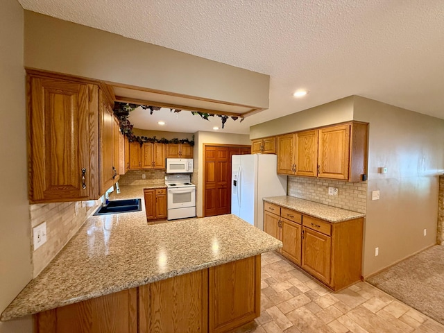 2705 6th St SW, Willmar, MN 56201 - kitchen with white appliances, brown cabinetry, decorative backsplash, a peninsula, and a textured ceiling