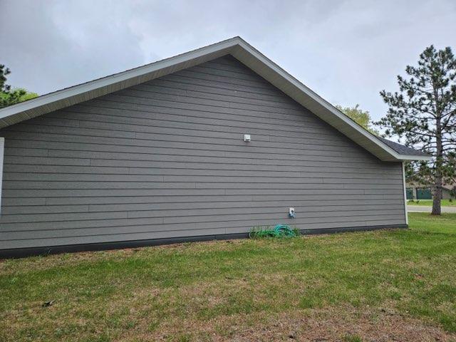 view of home's exterior featuring a lawn
