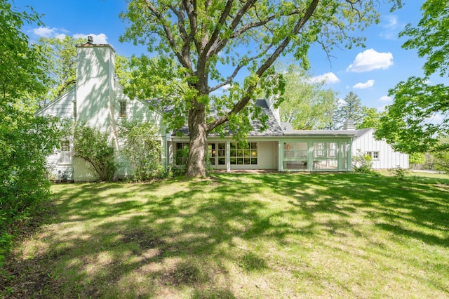 1429 20th St SW, Rochester, MN 55902 - rear view of property with a chimney and a lawn