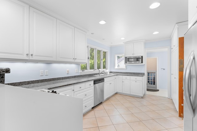 1429 20th St SW, Rochester, MN 55902 - kitchen featuring stainless steel appliances, ornamental molding, white cabinets, dark countertops, and recessed lighting