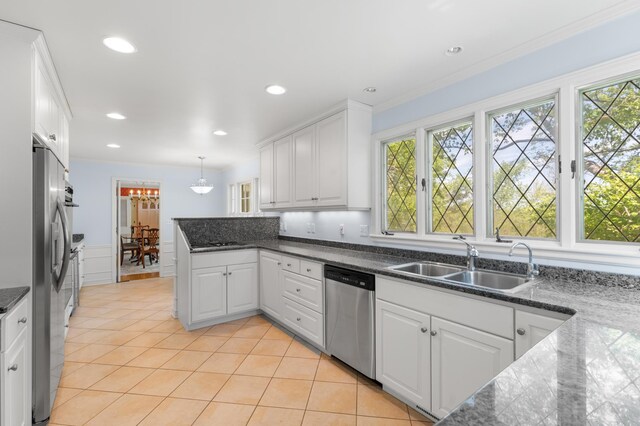 1429 20th St SW, Rochester, MN 55902 - kitchen with appliances with stainless steel finishes, white cabinetry, plenty of natural light, a peninsula, and recessed lighting