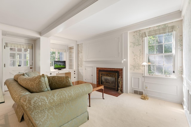1429 20th St SW, Rochester, MN 55902 - living room featuring light carpet, a brick fireplace, ornamental molding, a wainscoted wall, and a decorative wall