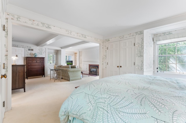 1429 20th St SW, Rochester, MN 55902 - bedroom with wallpapered walls, ornamental molding, multiple windows, carpet floors, and a glass covered fireplace