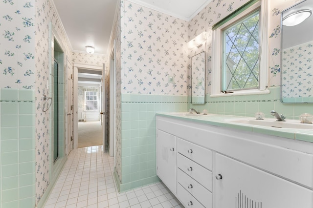 1429 20th St SW, Rochester, MN 55902 - bathroom with wallpapered walls, tile patterned flooring, ornamental molding, tile walls, and double vanity