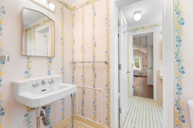 1429 20th St SW, Rochester, MN 55902 - bathroom with tile patterned flooring and ornamental molding