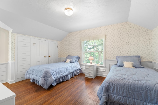 1429 20th St SW, Rochester, MN 55902 - bedroom featuring vaulted ceiling, wood finished floors, a wainscoted wall, wallpapered walls, and a textured ceiling