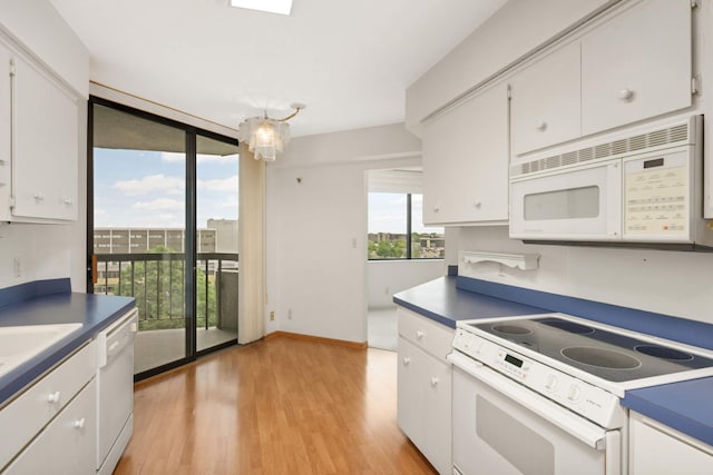 6566 France Ave S Unit 805, Edina, MN 55435 - kitchen with white appliances, white cabinetry, light wood-type flooring, dark countertops, and floor to ceiling windows
