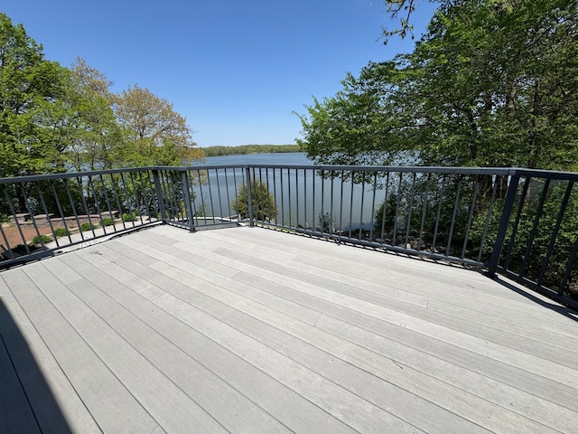 wooden deck with a water view