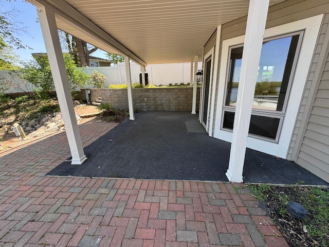 view of patio / terrace featuring fence