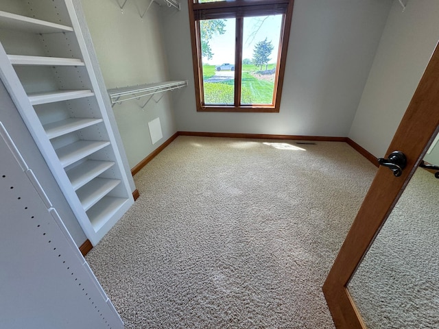 unfurnished bedroom featuring carpet flooring and baseboards