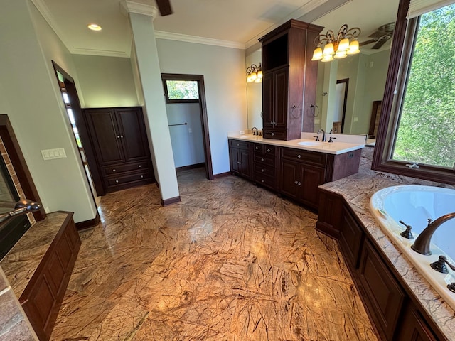 full bath with plenty of natural light, ornamental molding, a jetted tub, marble finish floors, and double vanity