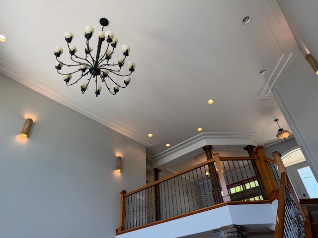staircase with recessed lighting, a chandelier, and crown molding