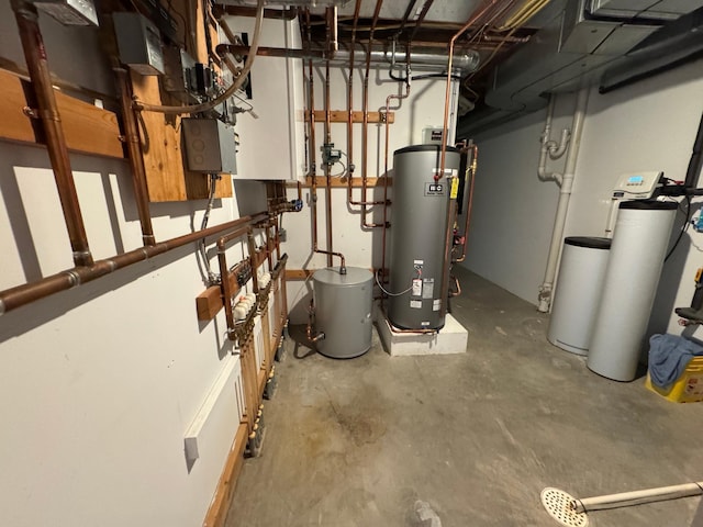 utility room featuring water heater and gas water heater