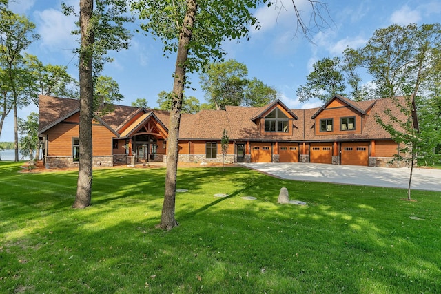 17488 Alexander Ct, Cold Spring, MN 56320 - view of front of property with stone siding, concrete driveway, and a front lawn