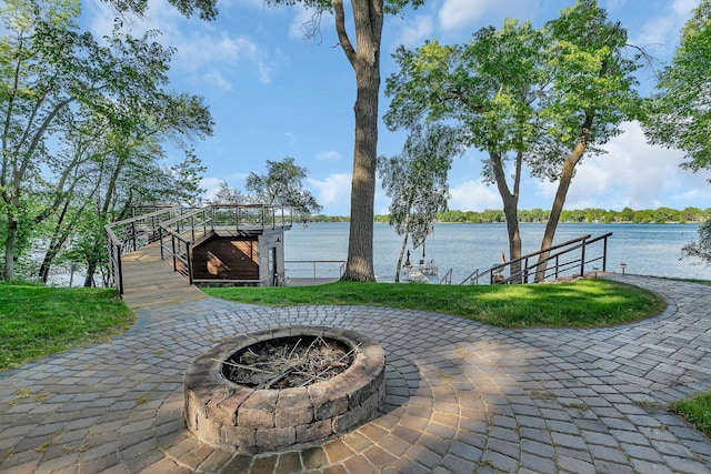 17488 Alexander Ct, Cold Spring, MN 56320 - view of patio / terrace with an outdoor fire pit, a water view, and a dock