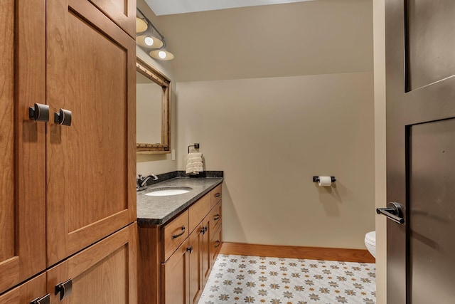 17488 Alexander Ct, Cold Spring, MN 56320 - bathroom featuring toilet, vanity, baseboards, and tile patterned floors