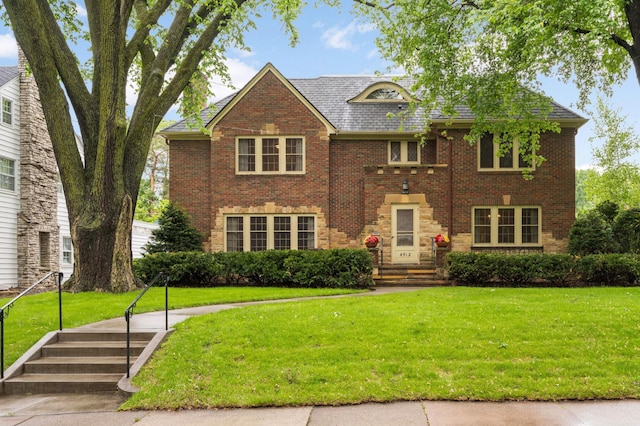 4512 Moorland Ave, Edina, MN 55424 - view of front of property with brick siding, a front lawn, and a high end roof
