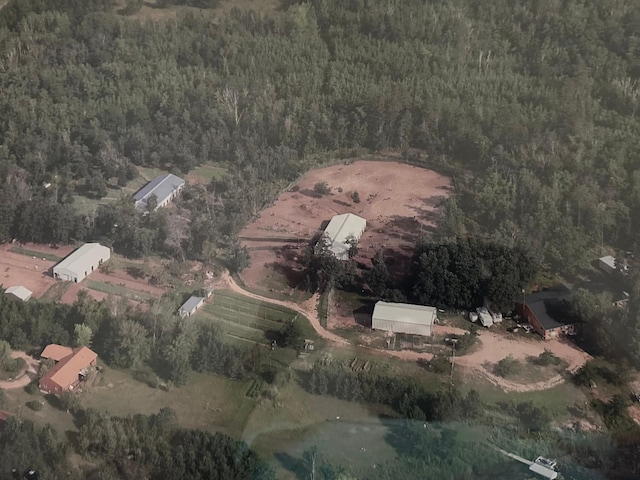 view of property location featuring a heavily wooded area