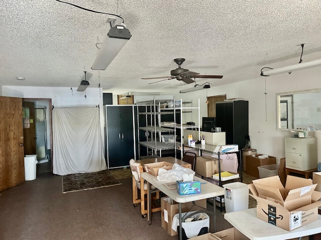 dining room with a ceiling fan and a textured ceiling
